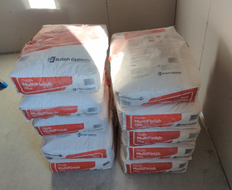 2 Stacks of 5 bags of 'British Gypsum Thistle MultiFinish 25kg' sitting in the corner of the garage