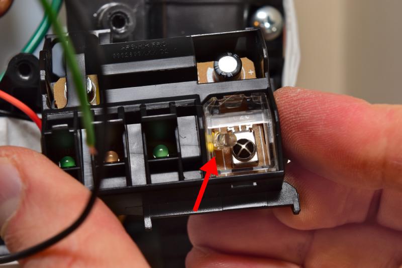 Close-up of the plastic assembly, showing the board with the infrared sensor clicked back in place, a loose infrared LED pushed right up to it behind the clear plastic window