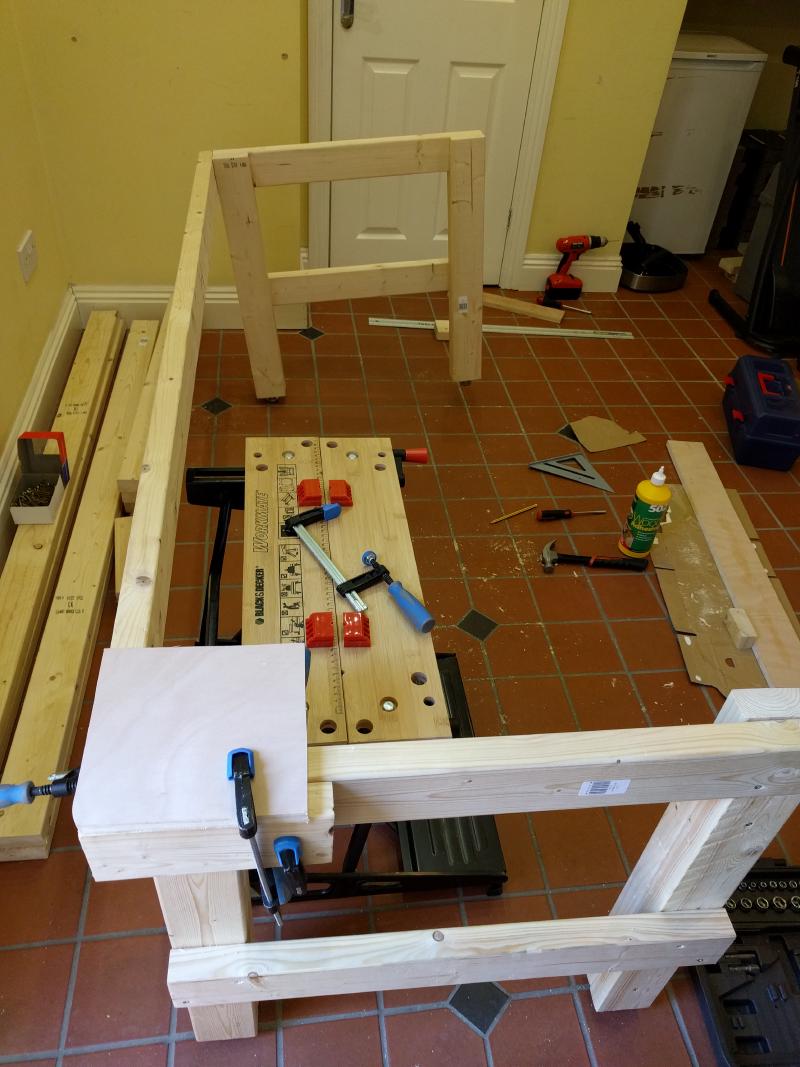 partial frame of the workbench, with one end kind of floating due to twist in one piece of lumber