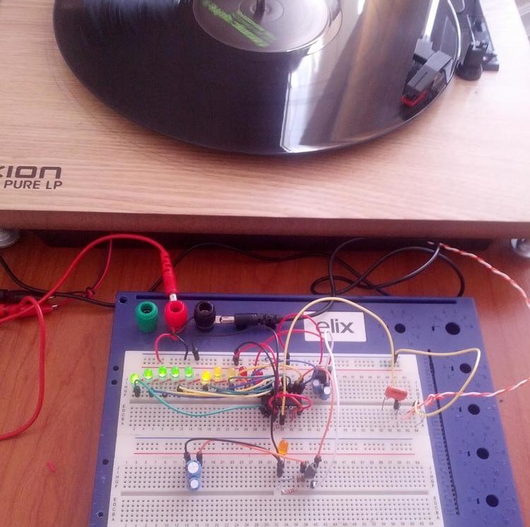 Turntable playing a record, connected to breadboard with some new additions